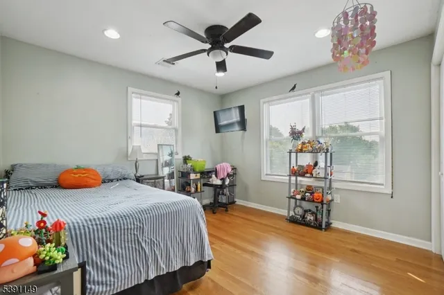 a bedroom with furniture and a window