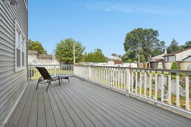 a view of a two chairs on the roof deck