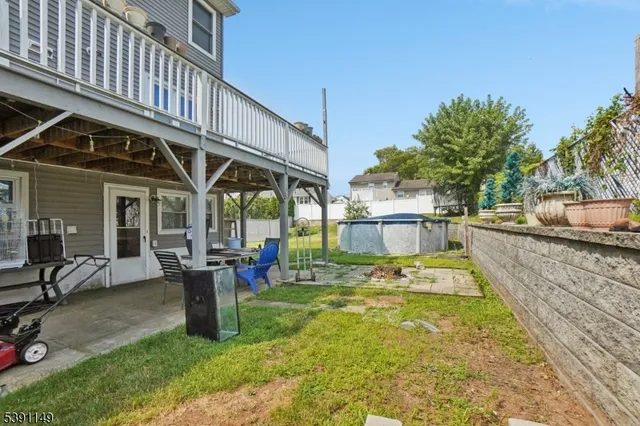a view of a swimming pool with chairs in patio