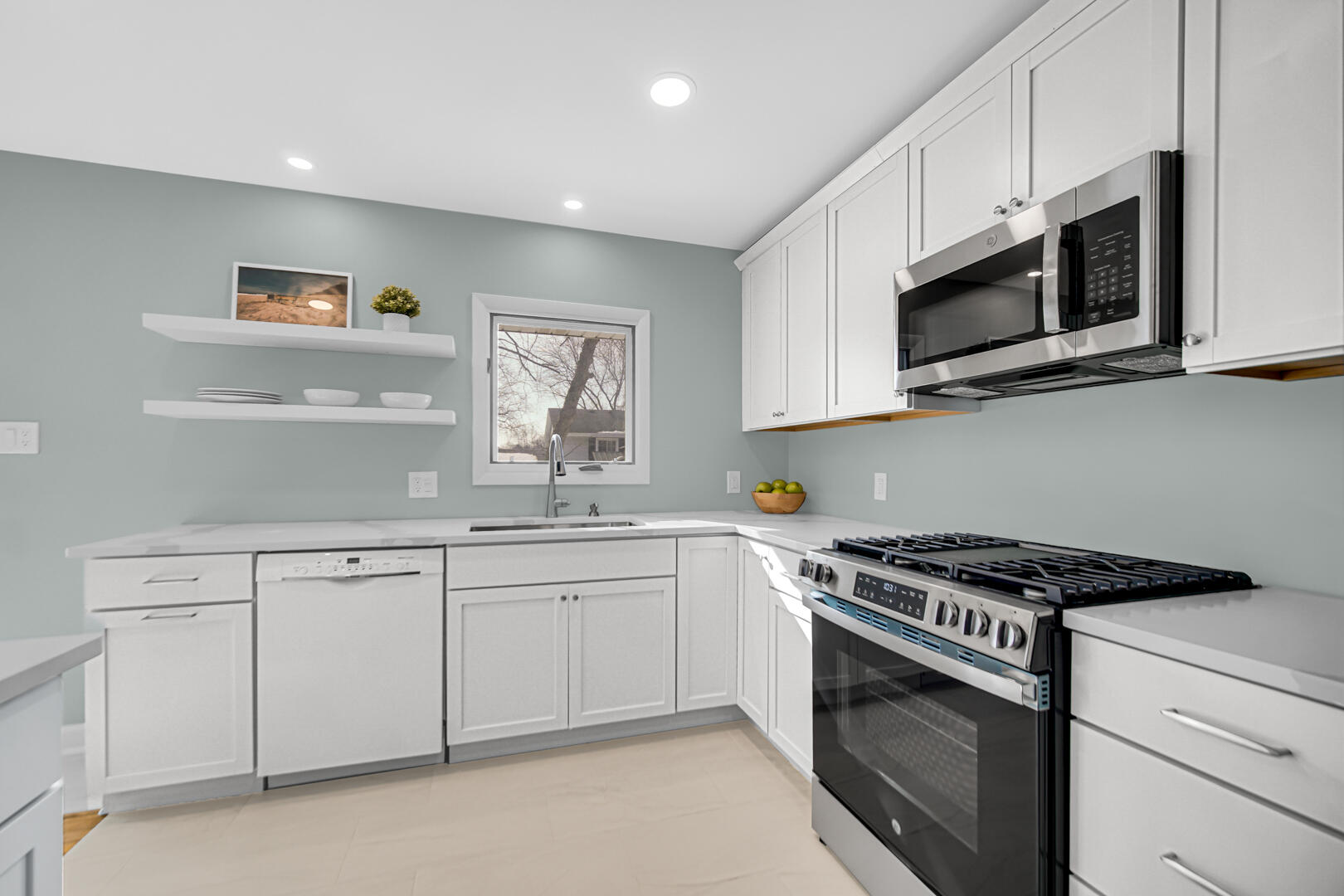 1515 West 94th Avenue Crown Point, IN 46307 - Photo 13 of 23 a kitchen with stainless steel appliances granite countertop white cabinets a sink and a stove