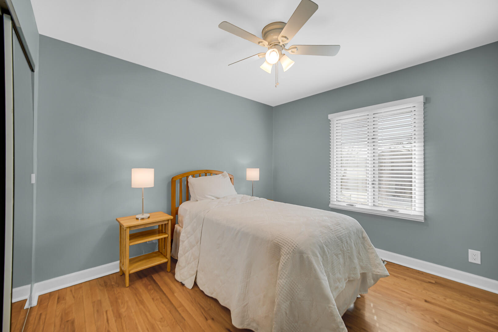 1515 West 94th Avenue Crown Point, IN 46307 - Photo 16 of 23 a bedroom with a bed and a chandelier