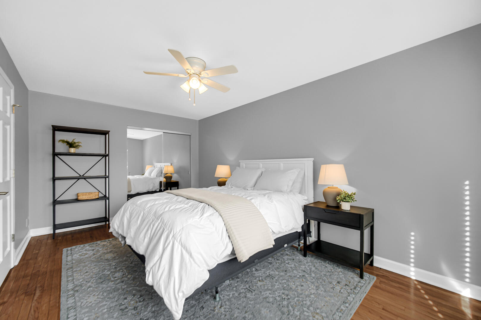 1515 West 94th Avenue Crown Point, IN 46307 - Photo 19 of 23 a bedroom with a bed and a chandelier