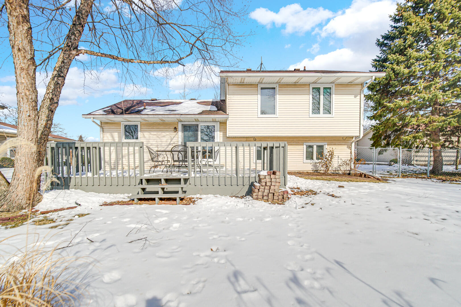 1515 West 94th Avenue Crown Point, IN 46307 - Photo 4 of 23 a view of a house with a patio and a yard