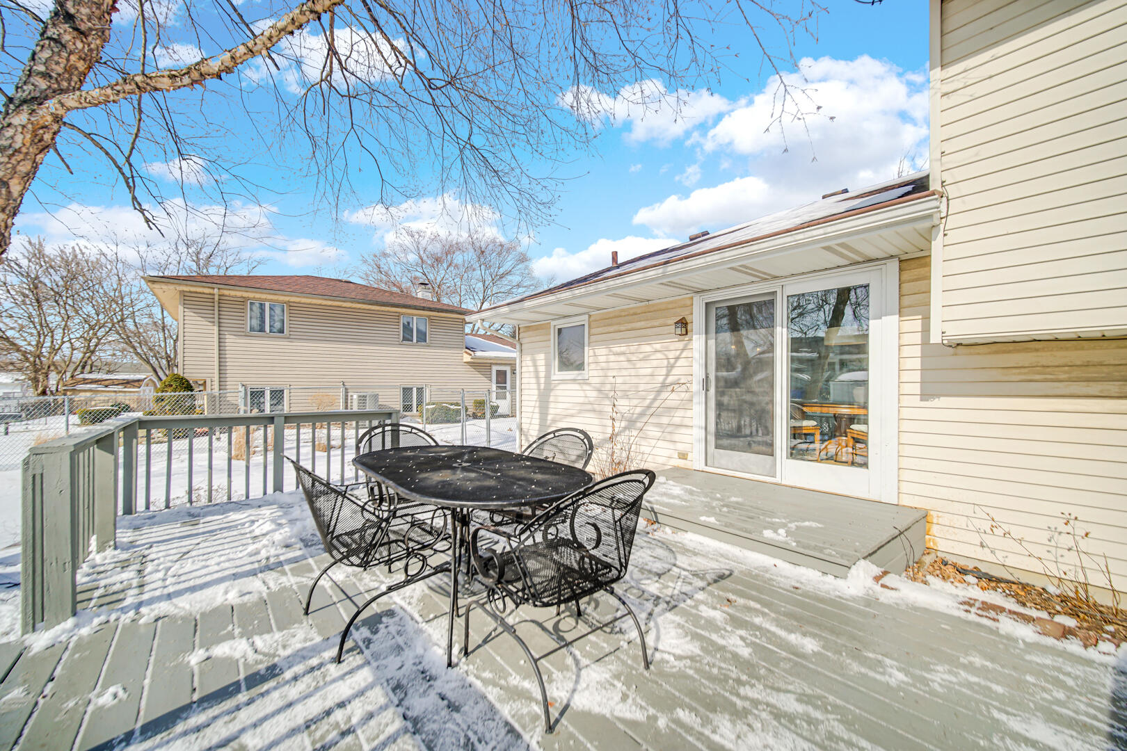 1515 West 94th Avenue Crown Point, IN 46307 - Photo 5 of 23 a patio with table and chairs and potted plants