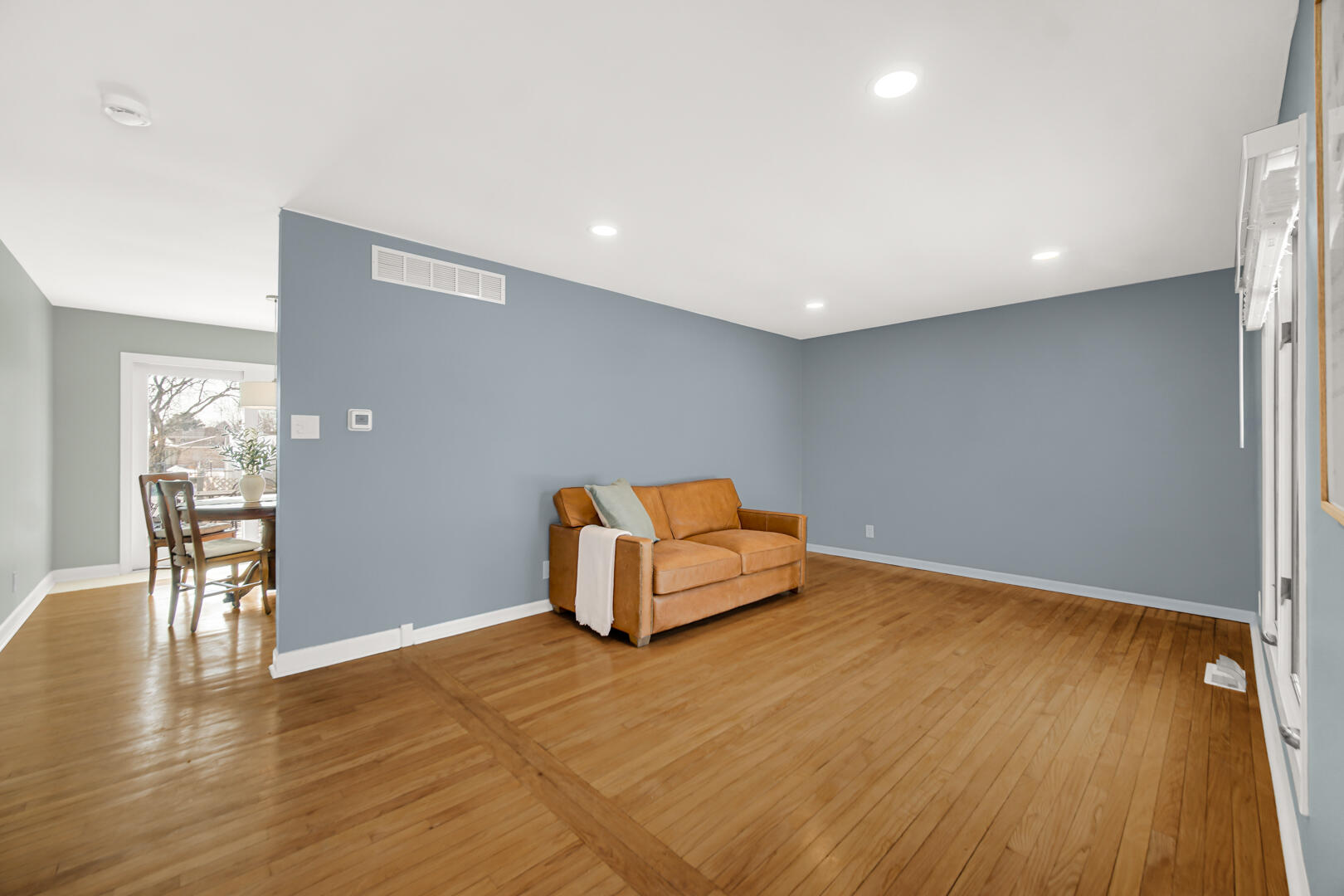 1515 West 94th Avenue Crown Point, IN 46307 - Photo 7 of 23 a room with wooden floor and table