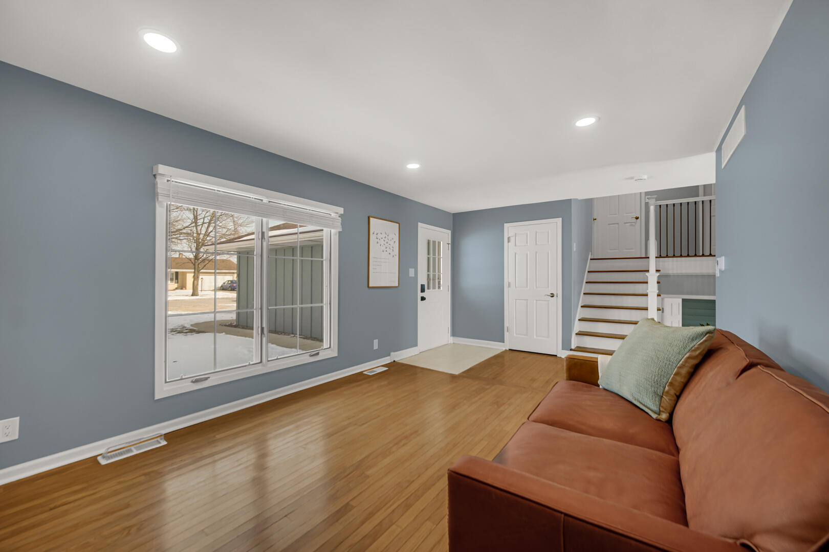 1515 West 94th Avenue Crown Point, IN 46307 - Photo 8 of 23 a bedroom with a bed and wooden floor