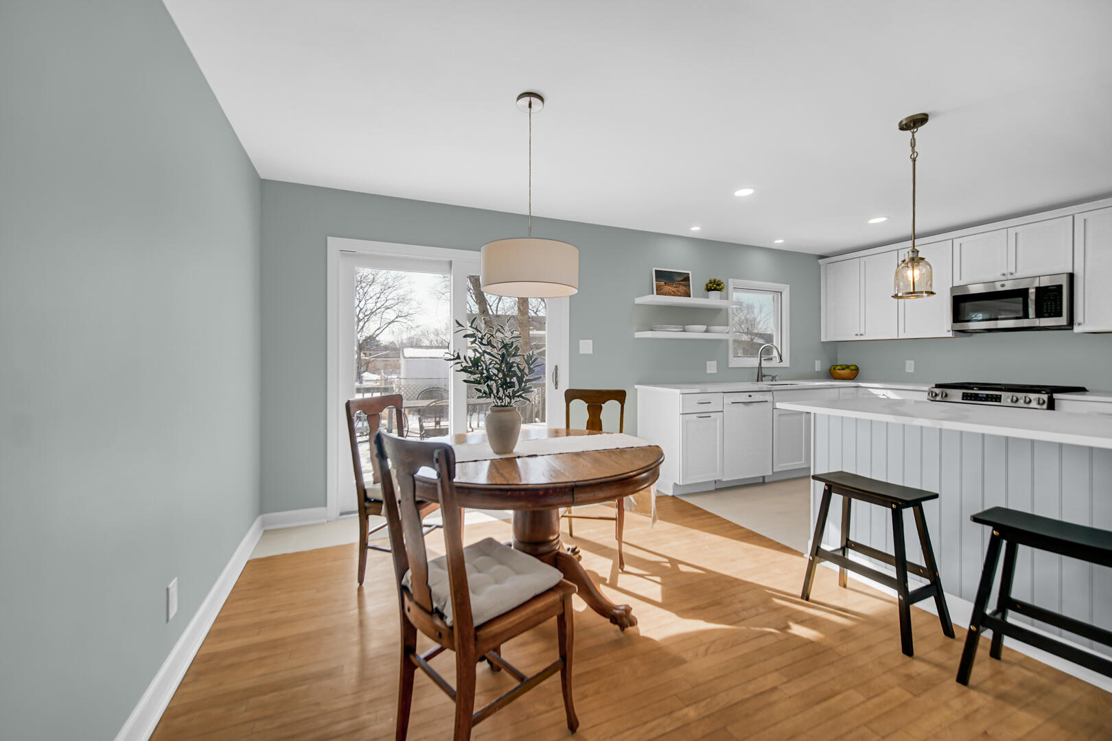 1515 West 94th Avenue Crown Point, IN 46307 - Photo 10 of 23 a view of a dining room with furniture window and wooden floor