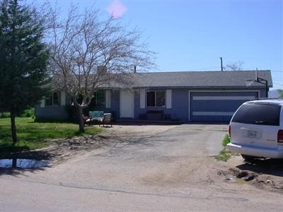 20993 Geronimo Road Apple Valley, CA 92308 - Photo 1 of 1 a house view with a backyard space