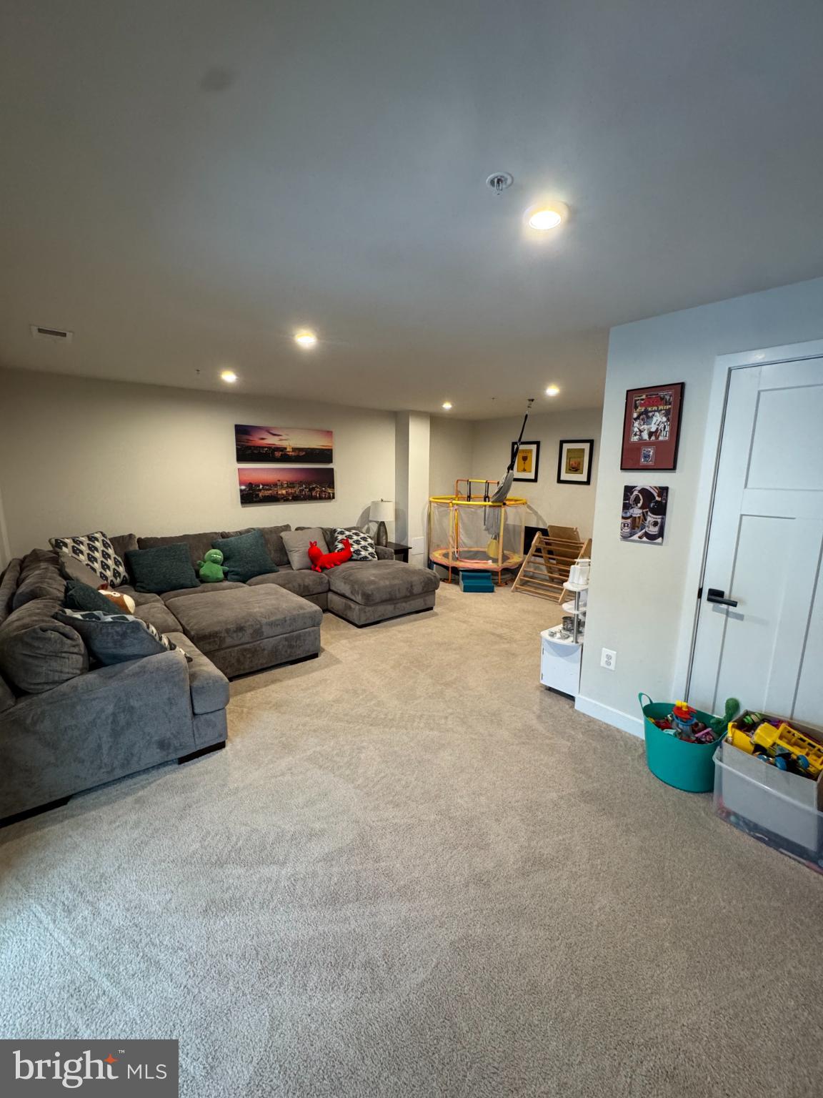 10706 Lamoka Lane New Market, MD 21774 - Photo 11 of 27 a living room with furniture and a flat screen tv