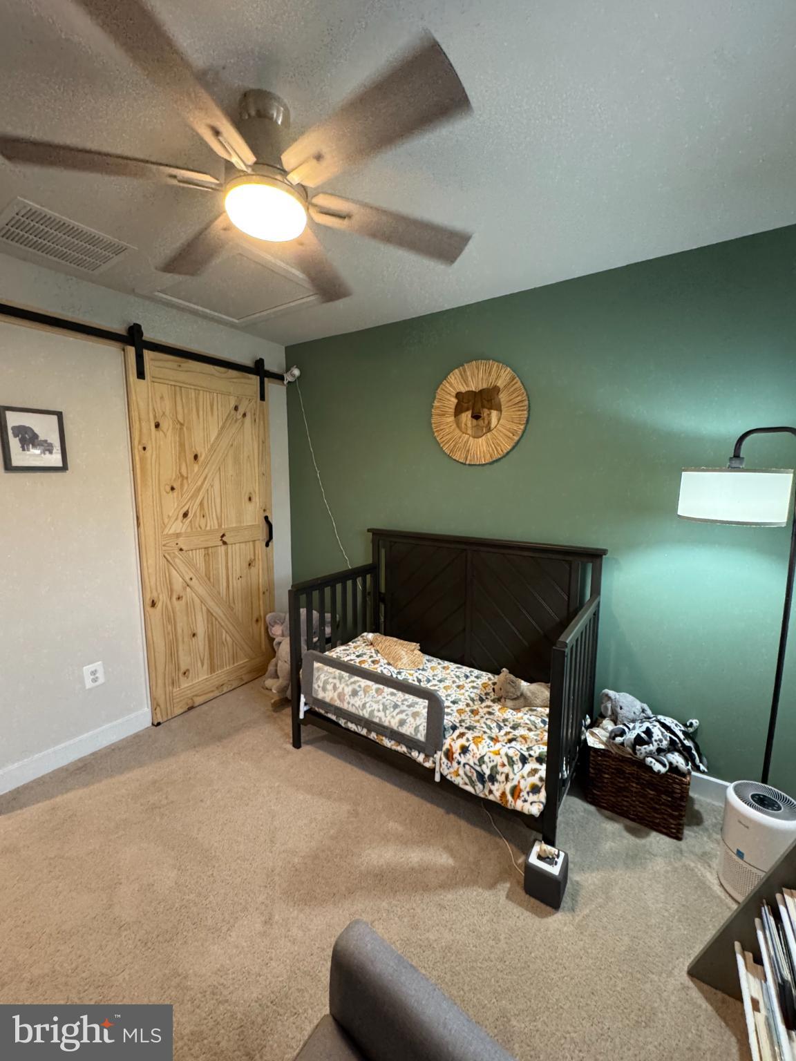 10706 Lamoka Lane New Market, MD 21774 - Photo 16 of 27 a bedroom with a bed and a wall painting