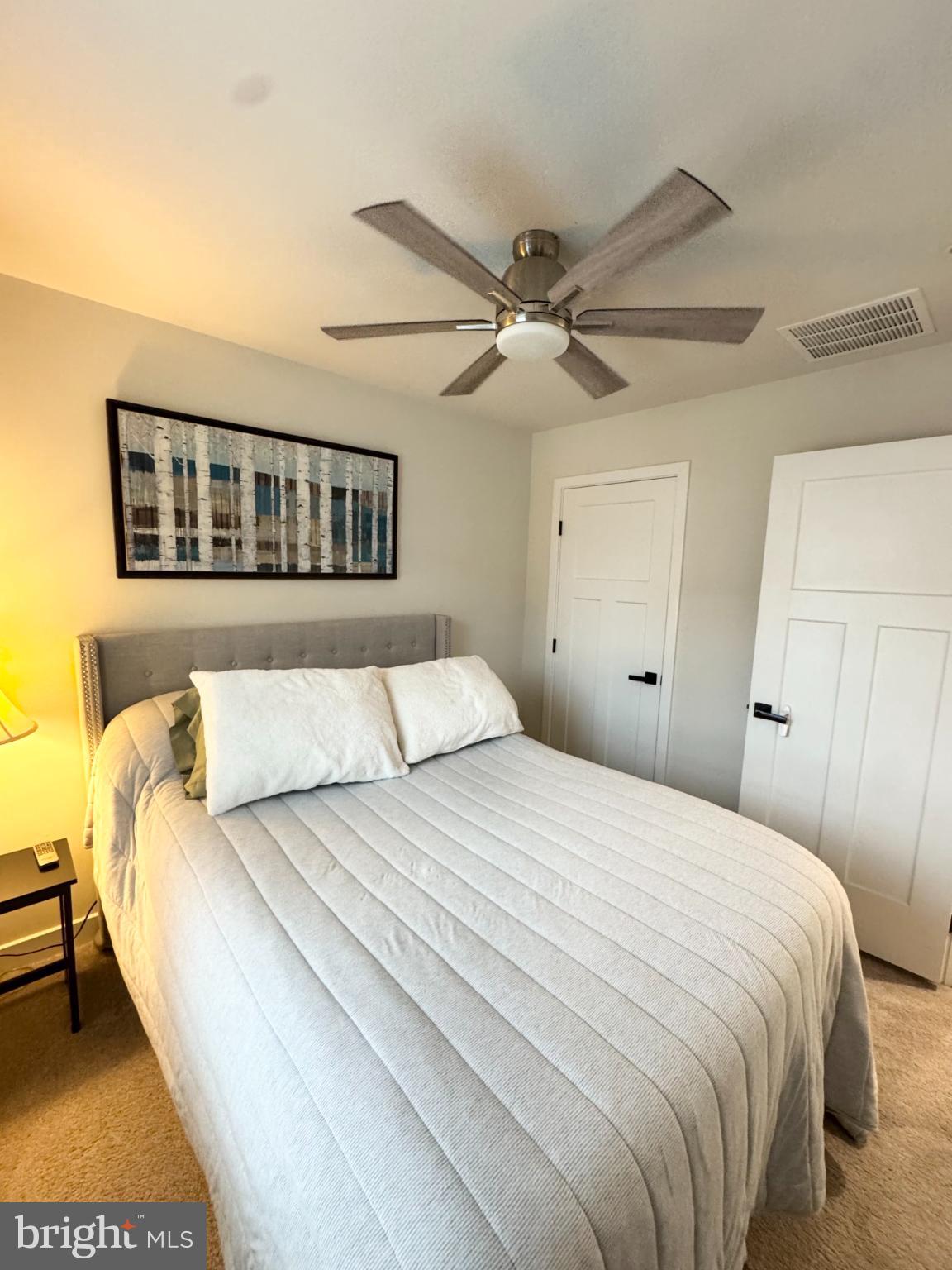 10706 Lamoka Lane New Market, MD 21774 - Photo 18 of 27 a bedroom with a bed and a ceiling fan
