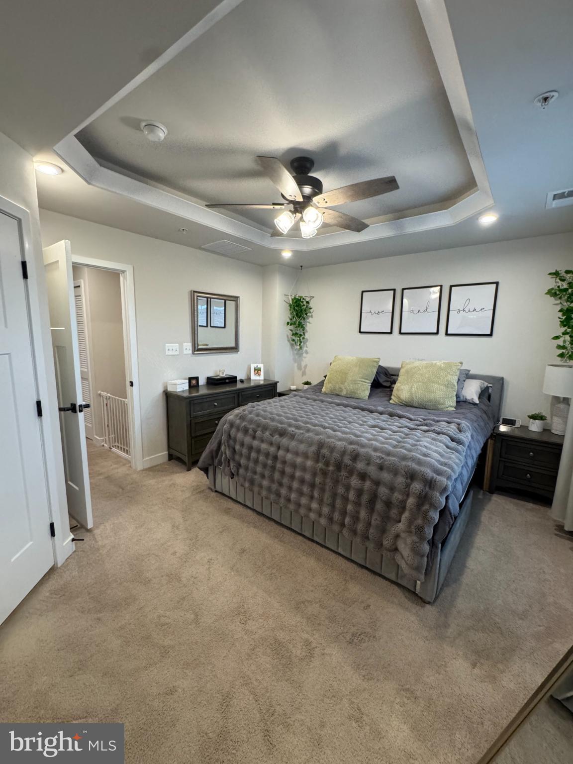 10706 Lamoka Lane New Market, MD 21774 - Photo 21 of 27 a bedroom with a large bed and a chandelier