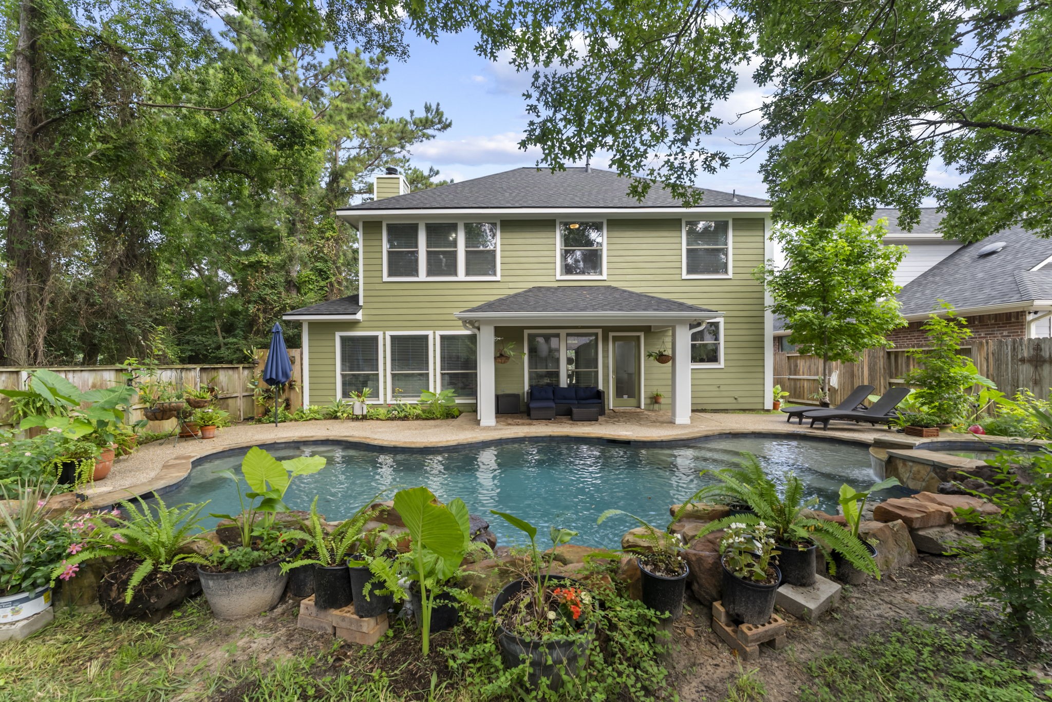 2106 Leaf Meadows Court Spring, TX 77386 - Photo 29 of 34 a front view of a house with swimming pool having outdoor seating