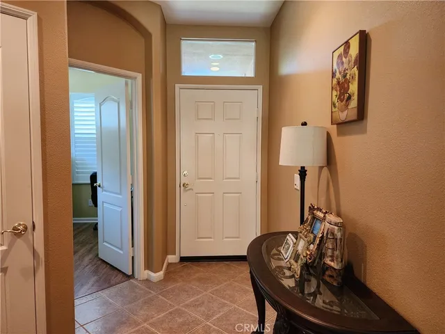 a room with a table and a mirror