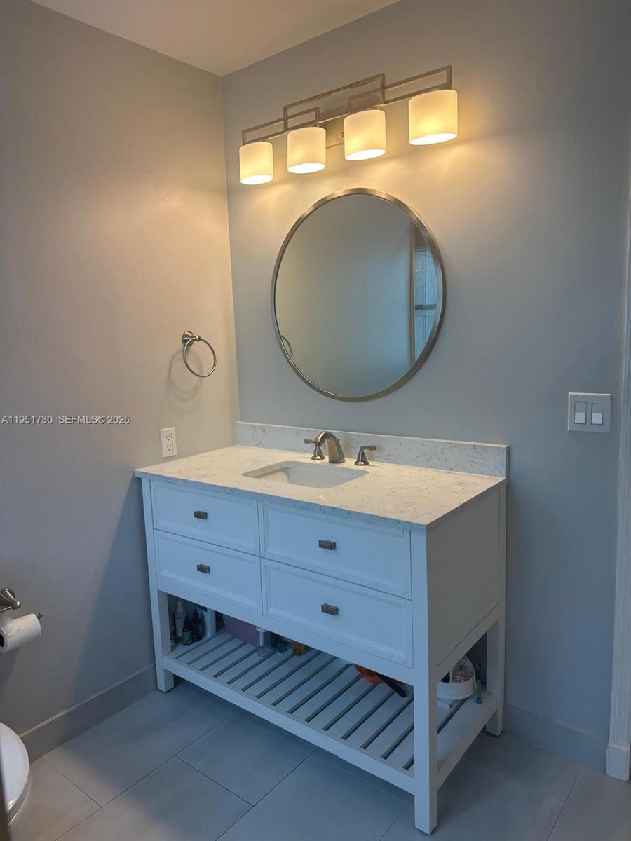 19922 Dinner Key Drive Boca Raton, FL 33498 - Photo 11 of 18 a bathroom with a sink mirror and vanity