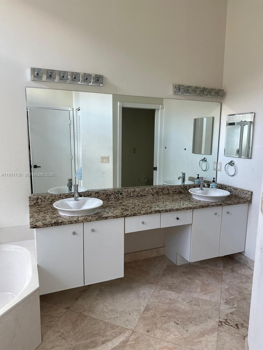 19922 Dinner Key Drive Boca Raton, FL 33498 - Photo 13 of 18 a bathroom with a sink and a mirror