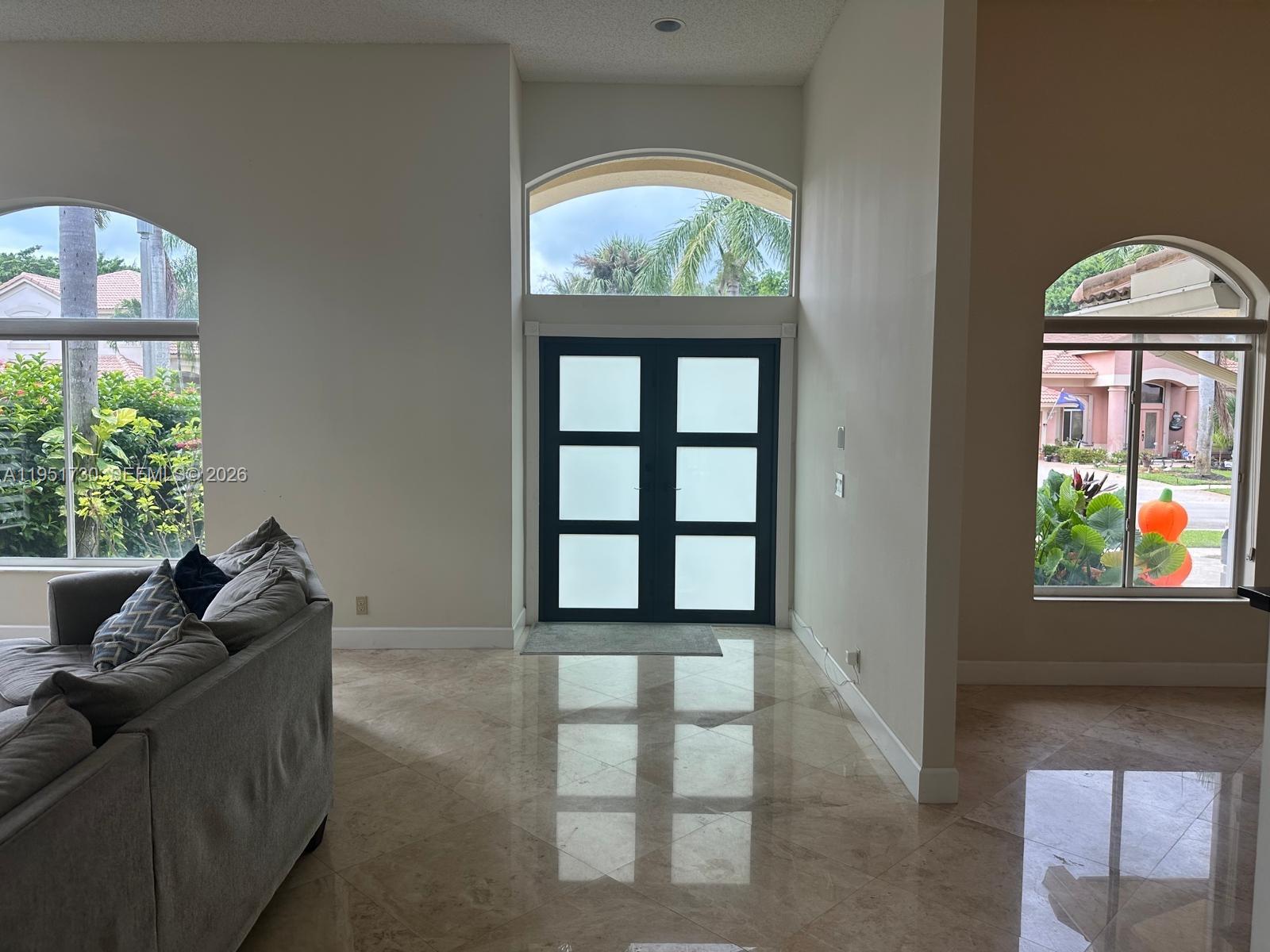 19922 Dinner Key Drive Boca Raton, FL 33498 - Photo 2 of 18 a living room with furniture and a window