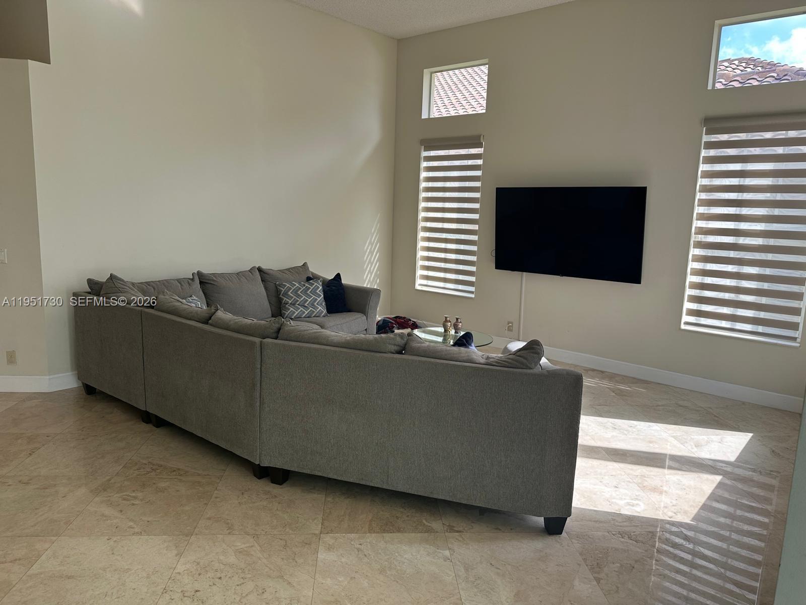 19922 Dinner Key Drive Boca Raton, FL 33498 - Photo 3 of 18 a living room with furniture and a flat screen tv