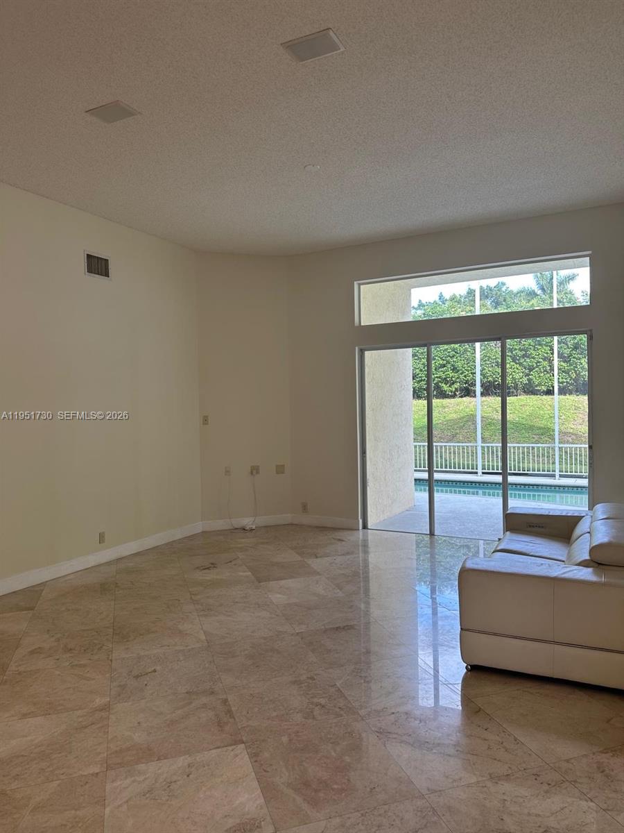 19922 Dinner Key Drive Boca Raton, FL 33498 - Photo 5 of 18 a living room with furniture and a large window