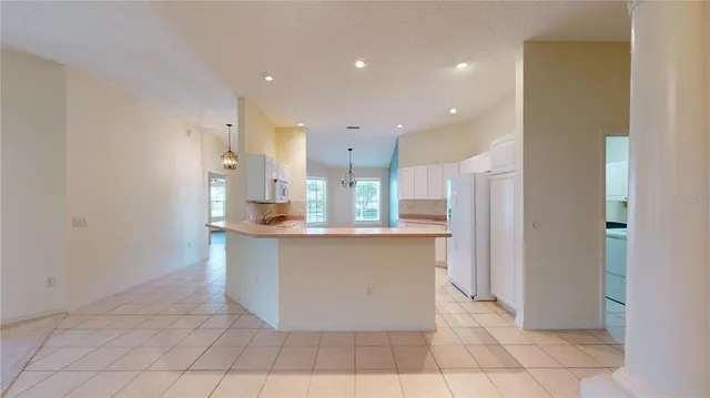 a kitchen with stainless steel appliances a sink and a refrigerator