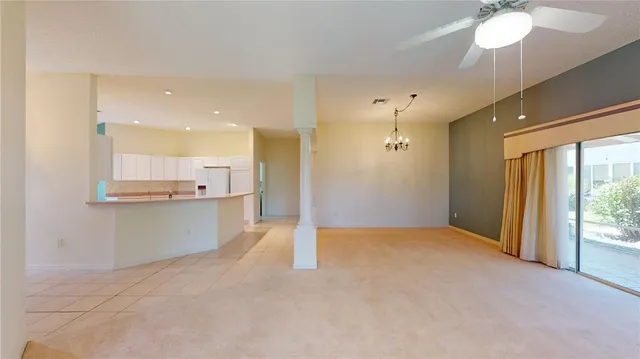 a view of a kitchen with a sink and a large window