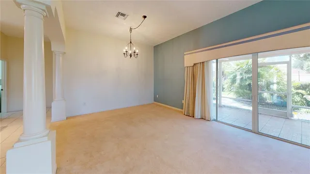 a view of empty room with floor to ceiling window