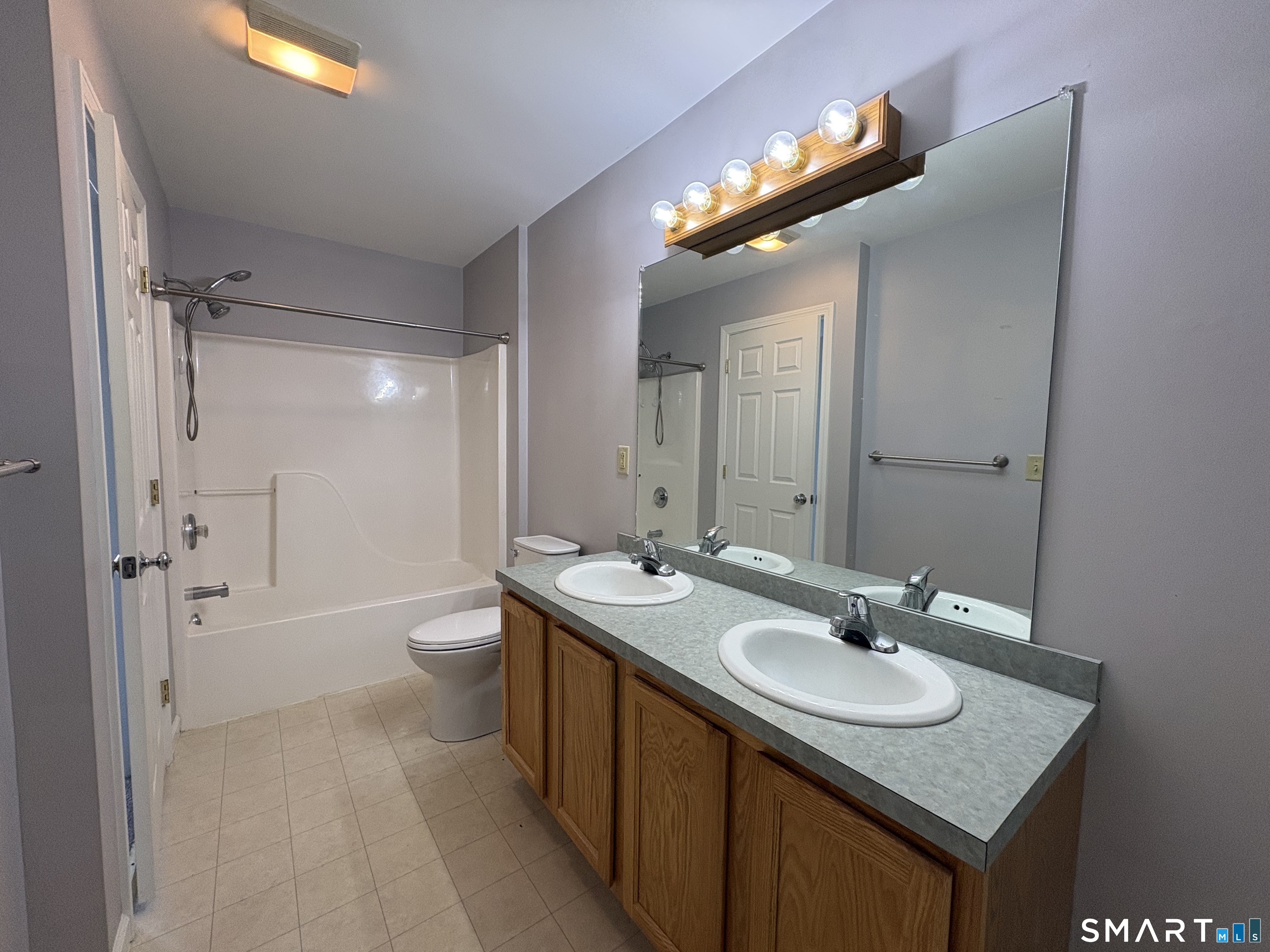267 Bridge Street, Unit 18 Groton, CT 06340 - Photo 12 of 16 a bathroom with a sink and a mirror