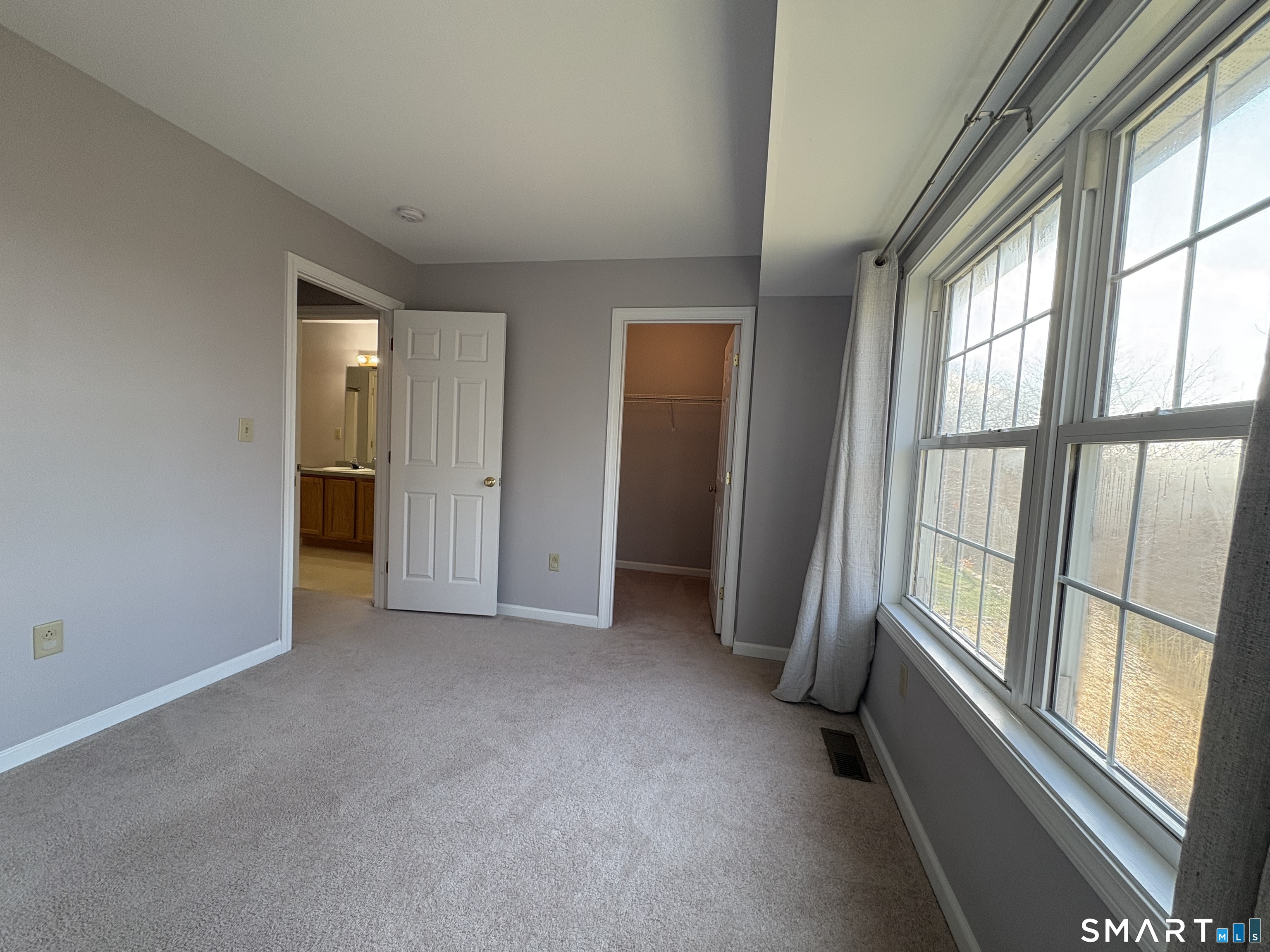 267 Bridge Street, Unit 18 Groton, CT 06340 - Photo 14 of 16 an empty room with windows