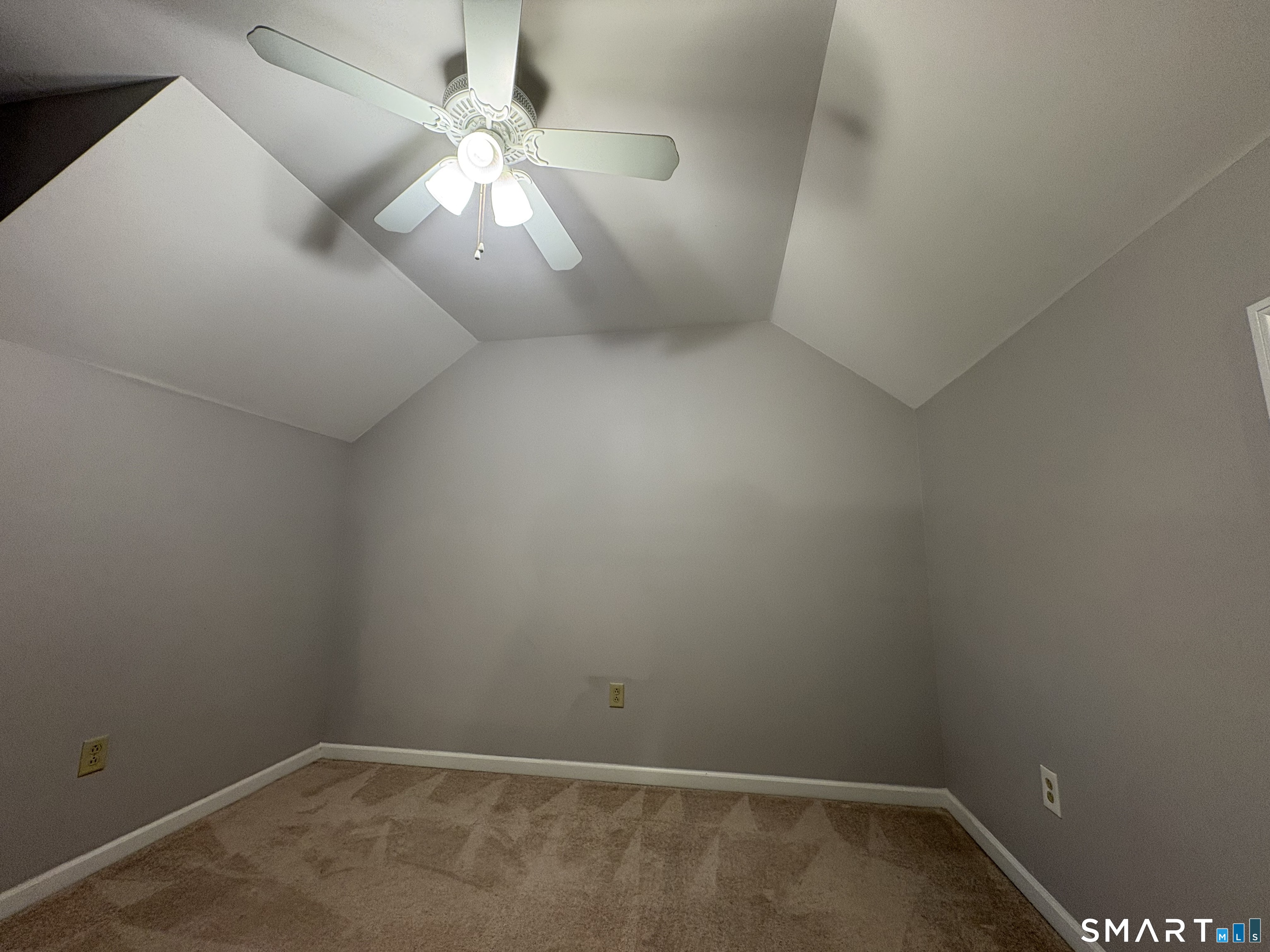 267 Bridge Street, Unit 18 Groton, CT 06340 - Photo 15 of 16 en empty room with windows and fan
