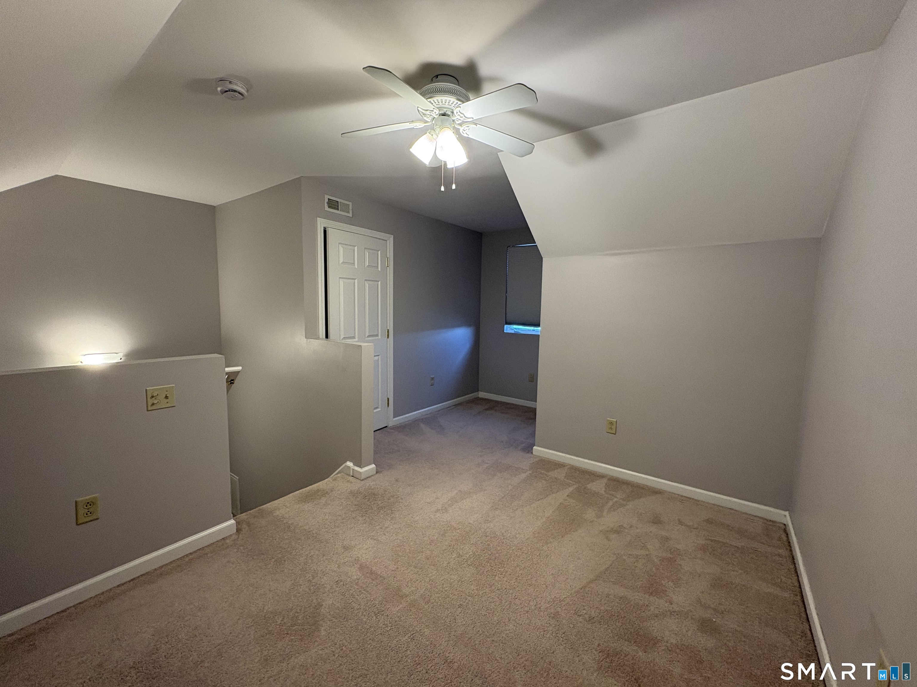 267 Bridge Street, Unit 18 Groton, CT 06340 - Photo 16 of 16 wooden floor in an empty room with a mirror