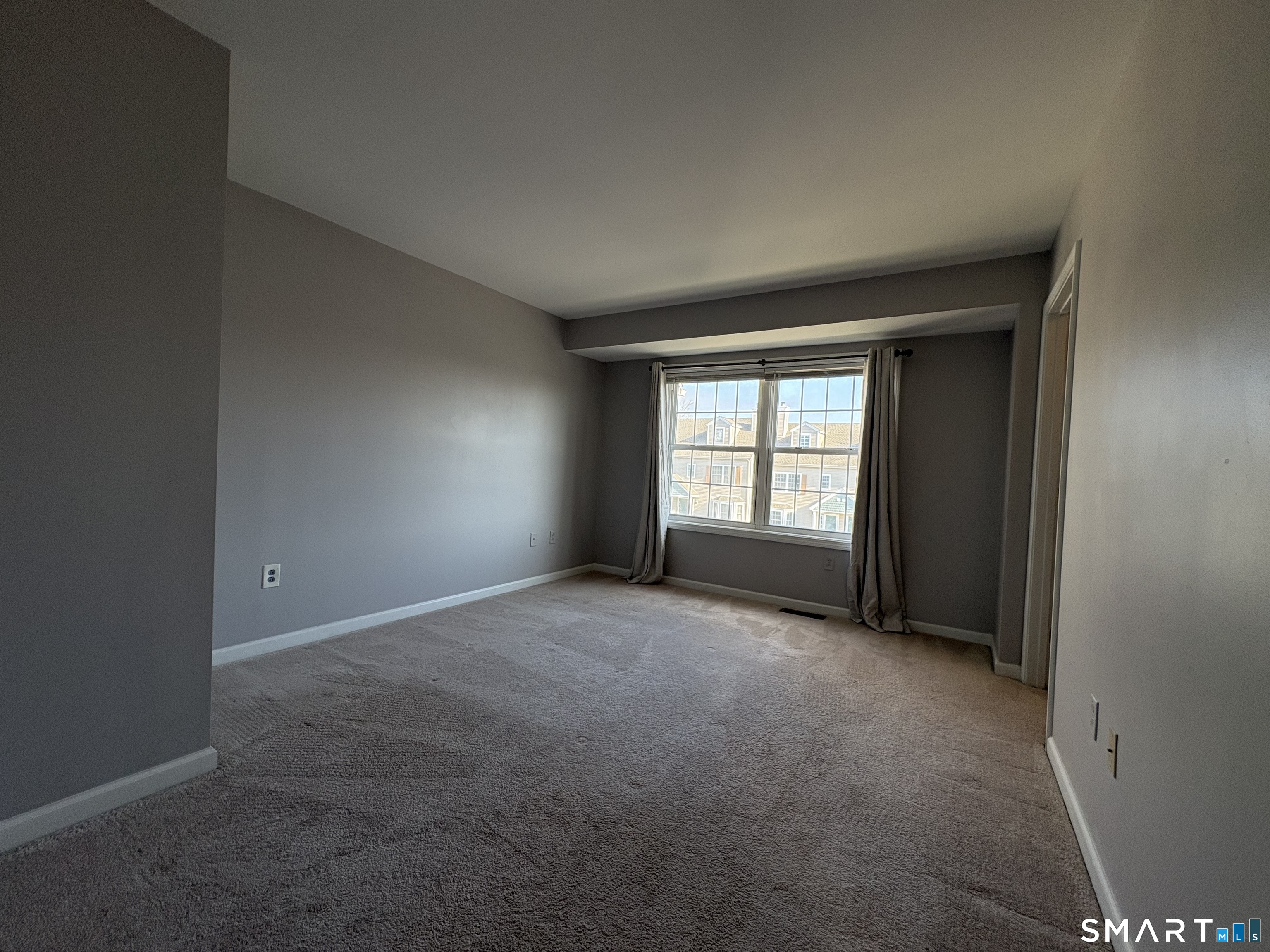 267 Bridge Street, Unit 18 Groton, CT 06340 - Photo 10 of 16 a view of empty room with a fireplace