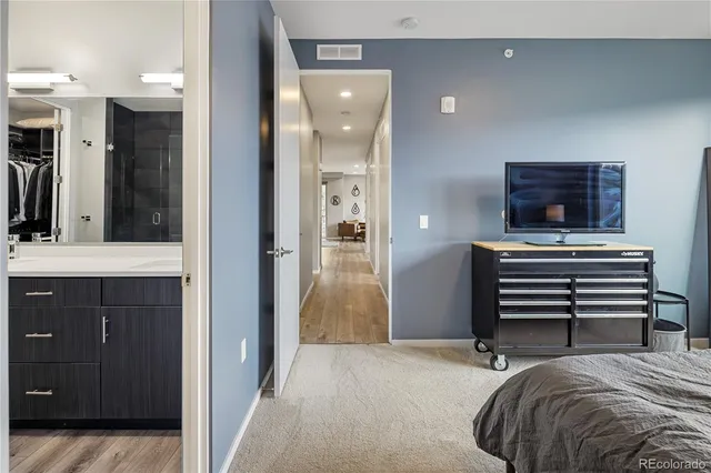 a bedroom with a bed and a dresser