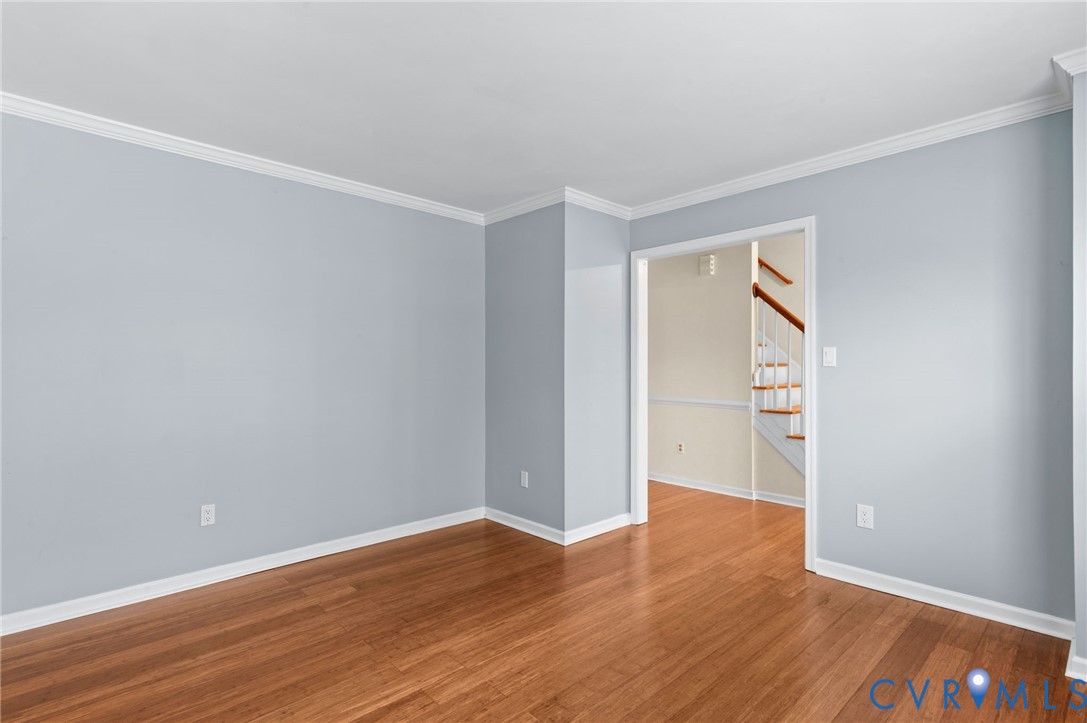 3440 Hunter's Ridge Williamsburg, VA 23188 - Photo 24 of 30 Spare room featuring crown molding, stairway, and