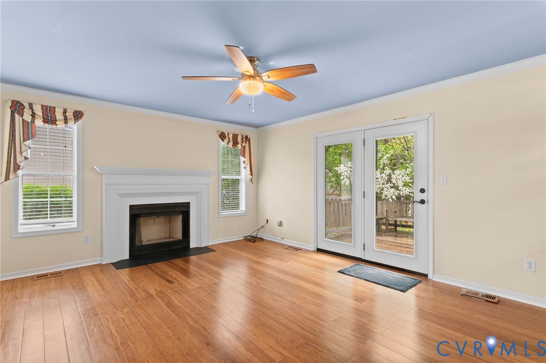 3440 Hunter's Ridge Williamsburg, VA 23188 - Photo 4 of 30 Unfurnished living room with crown molding, light