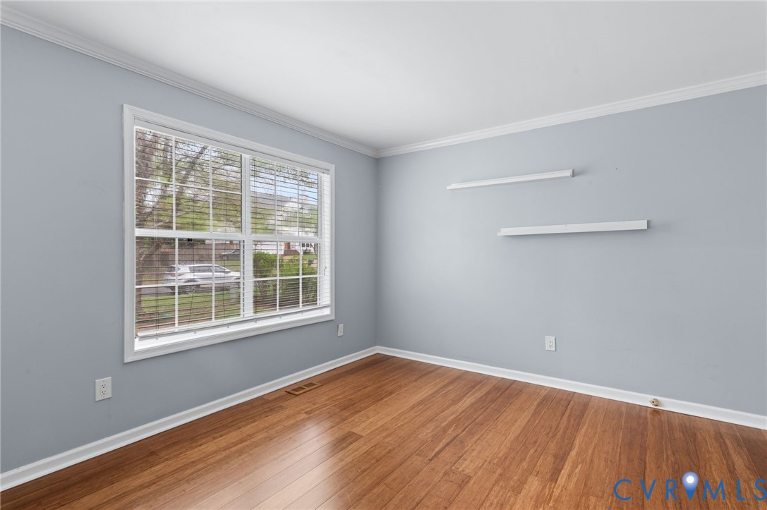 3440 Hunter's Ridge Williamsburg, VA 23188 - Photo 6 of 30 Empty room with crown molding and hardwood / wood-