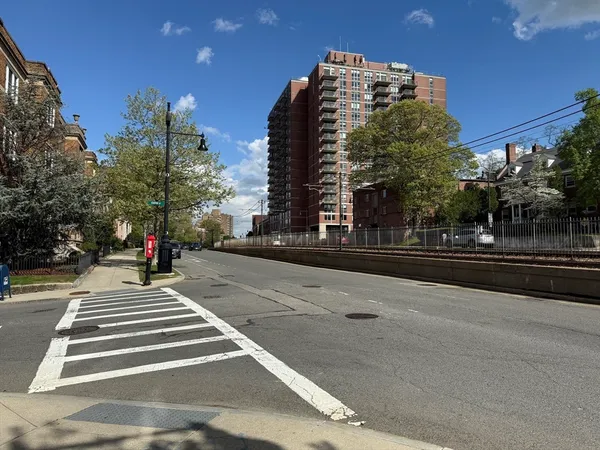a view of street with parked cars