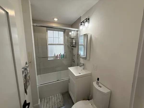 a kitchen with sink cabinets and appliances