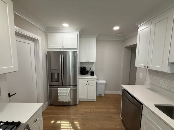 a kitchen that has a sink and a stove