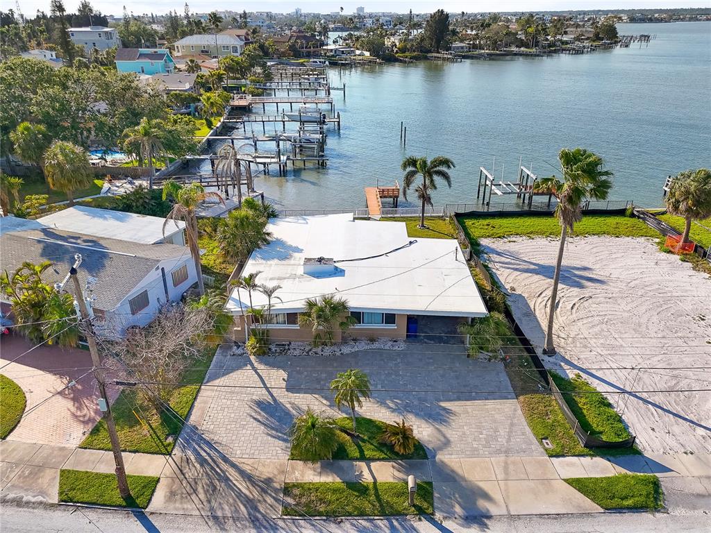 15305 Harbor Drive Madeira Beach, FL 33708 - Photo 2 of 16 an aerial view of a house with outdoor seating swimming pool and ocean view