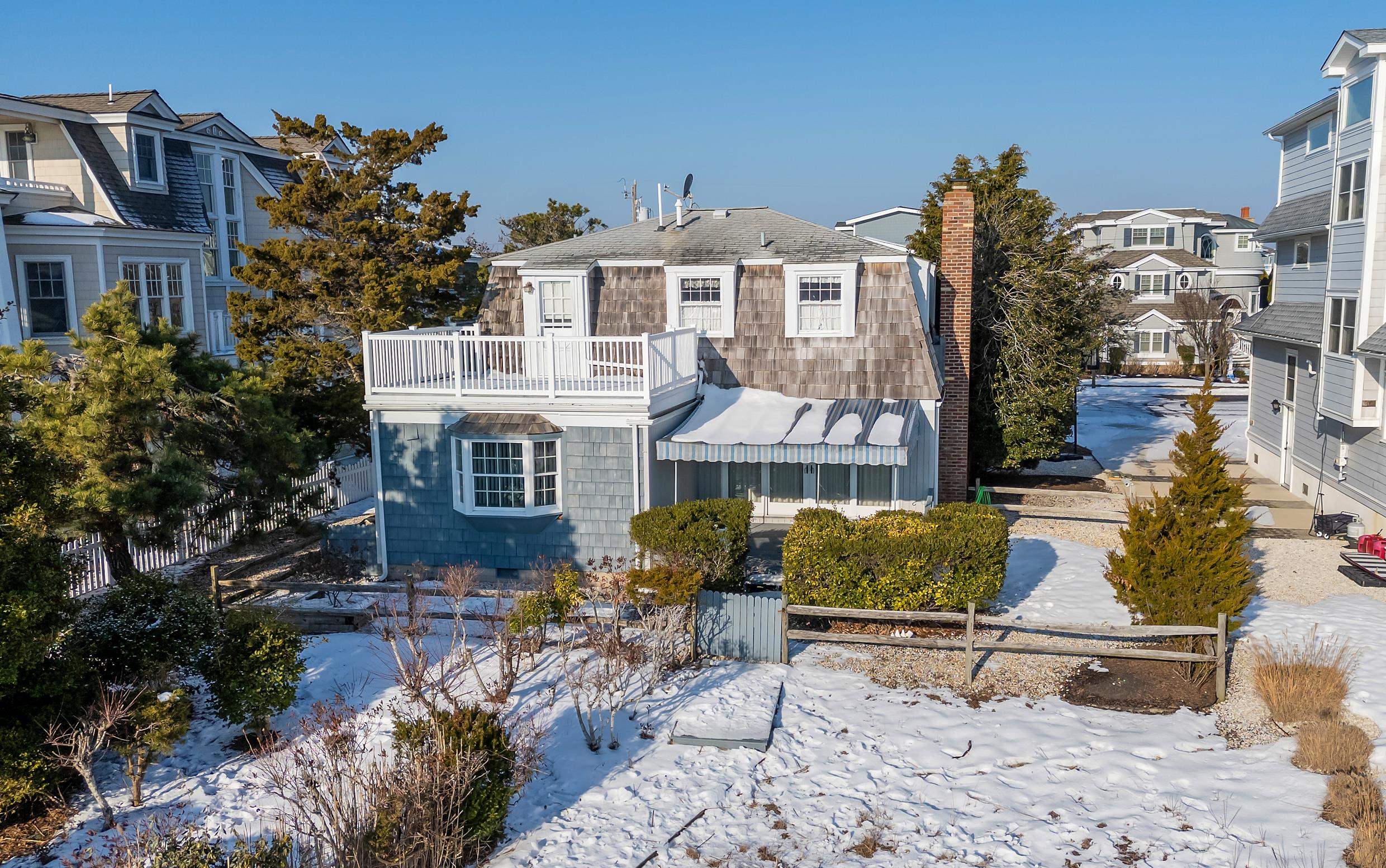 4599 5th Avalon, NJ 08202 - Photo 11 of 14 a front view of a house with garden