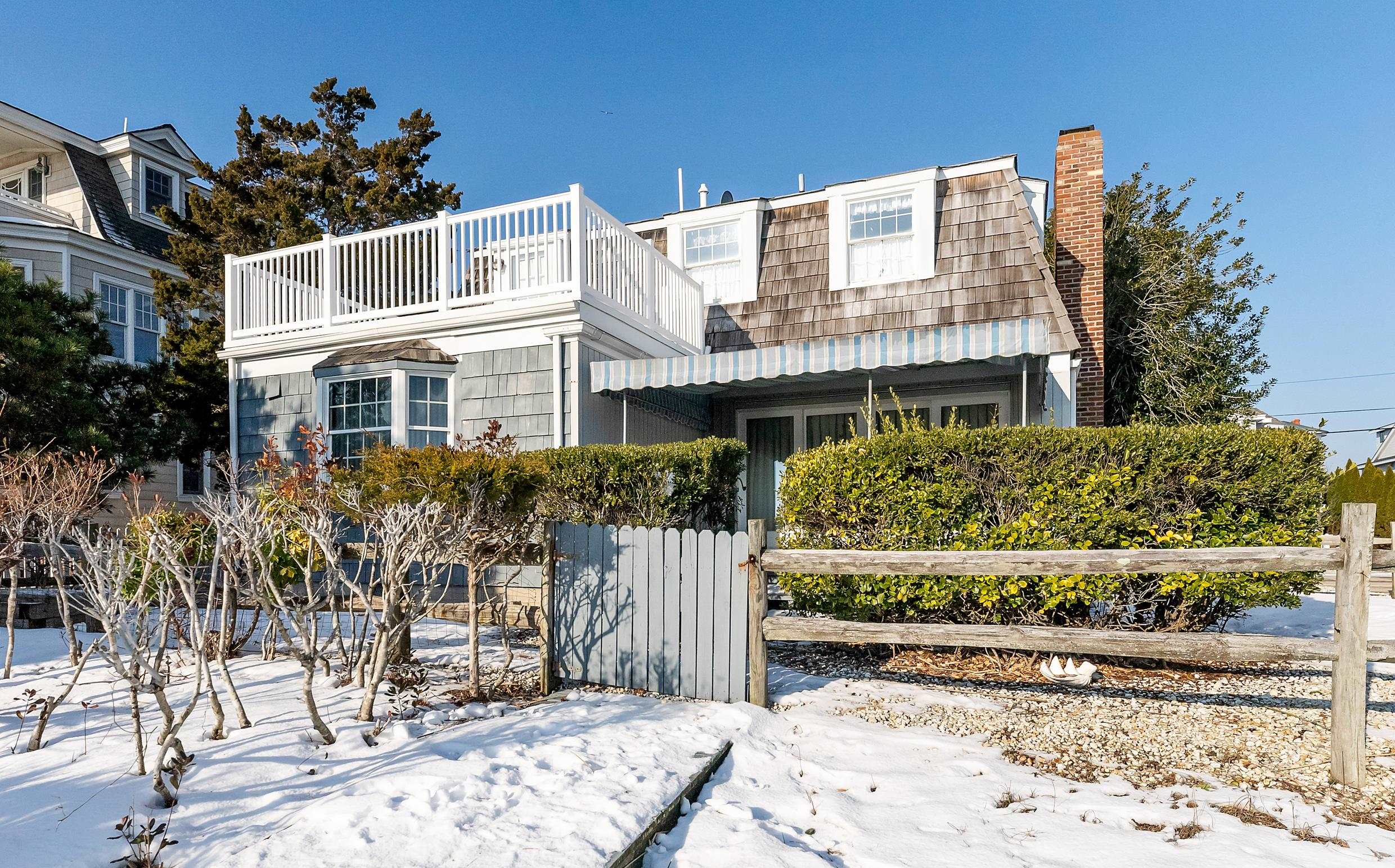 4599 5th Avalon, NJ 08202 - Photo 12 of 14 a front view of a house with a garden