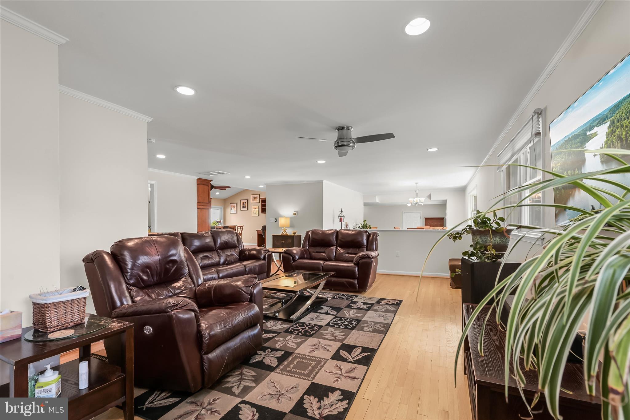 6910 Pindell School Road Clarksville, MD 21029 - Photo 16 of 73 a media room with lots of chairs and a chandelier