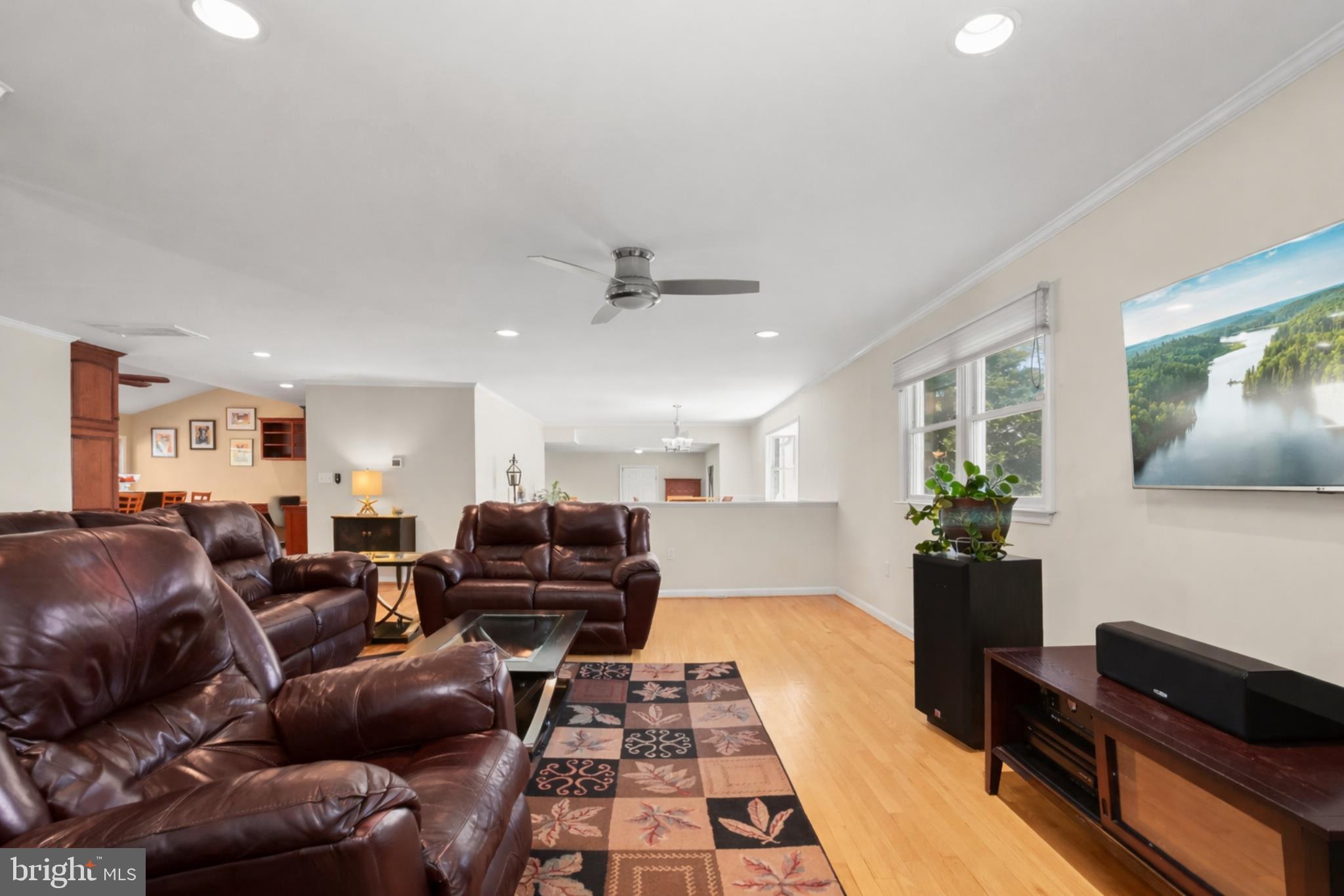 6910 Pindell School Road Clarksville, MD 21029 - Photo 17 of 73 a living room with furniture and a wooden floor