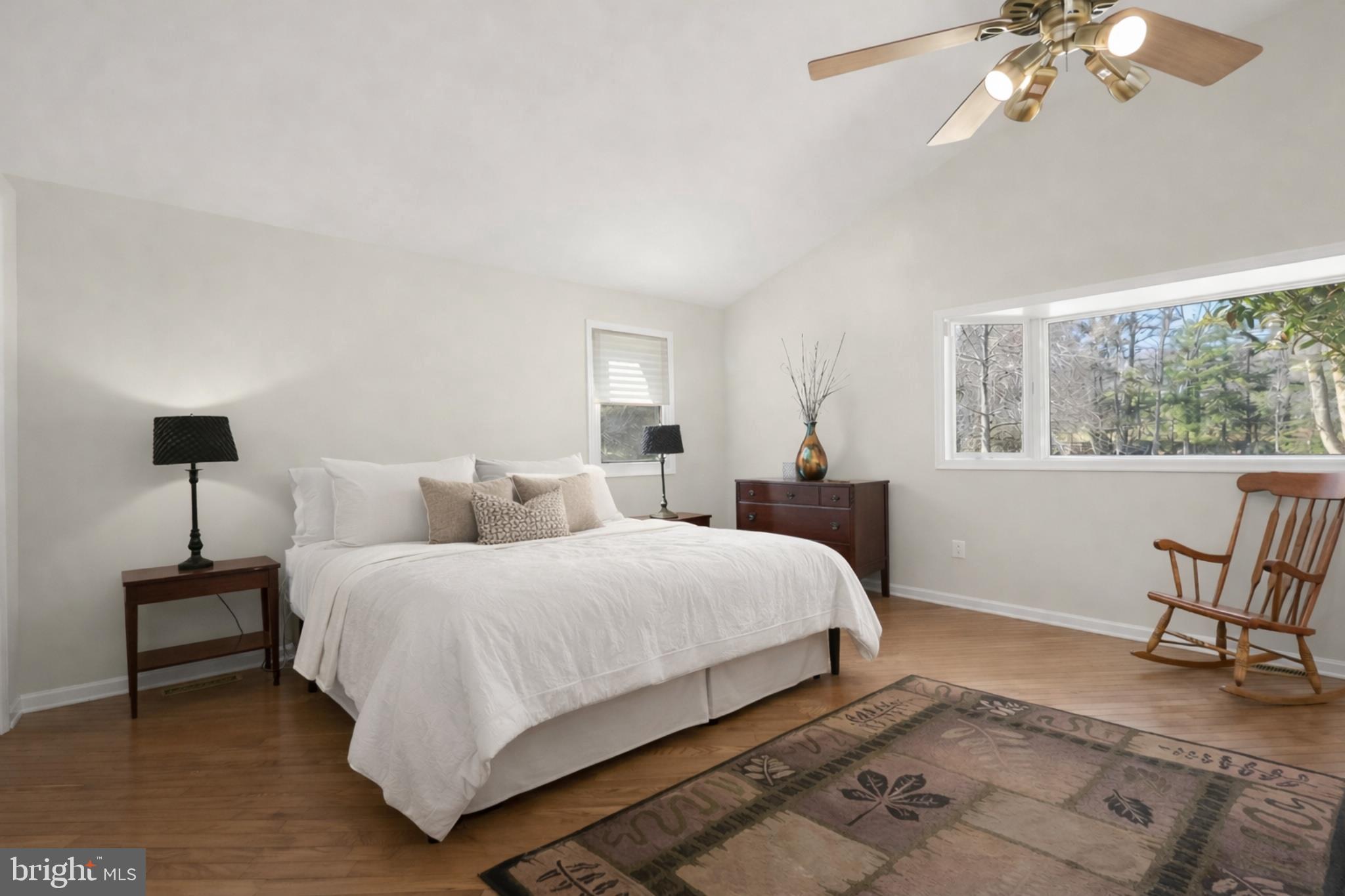 6910 Pindell School Road Clarksville, MD 21029 - Photo 34 of 73 a bedroom with a bed and a chandelier