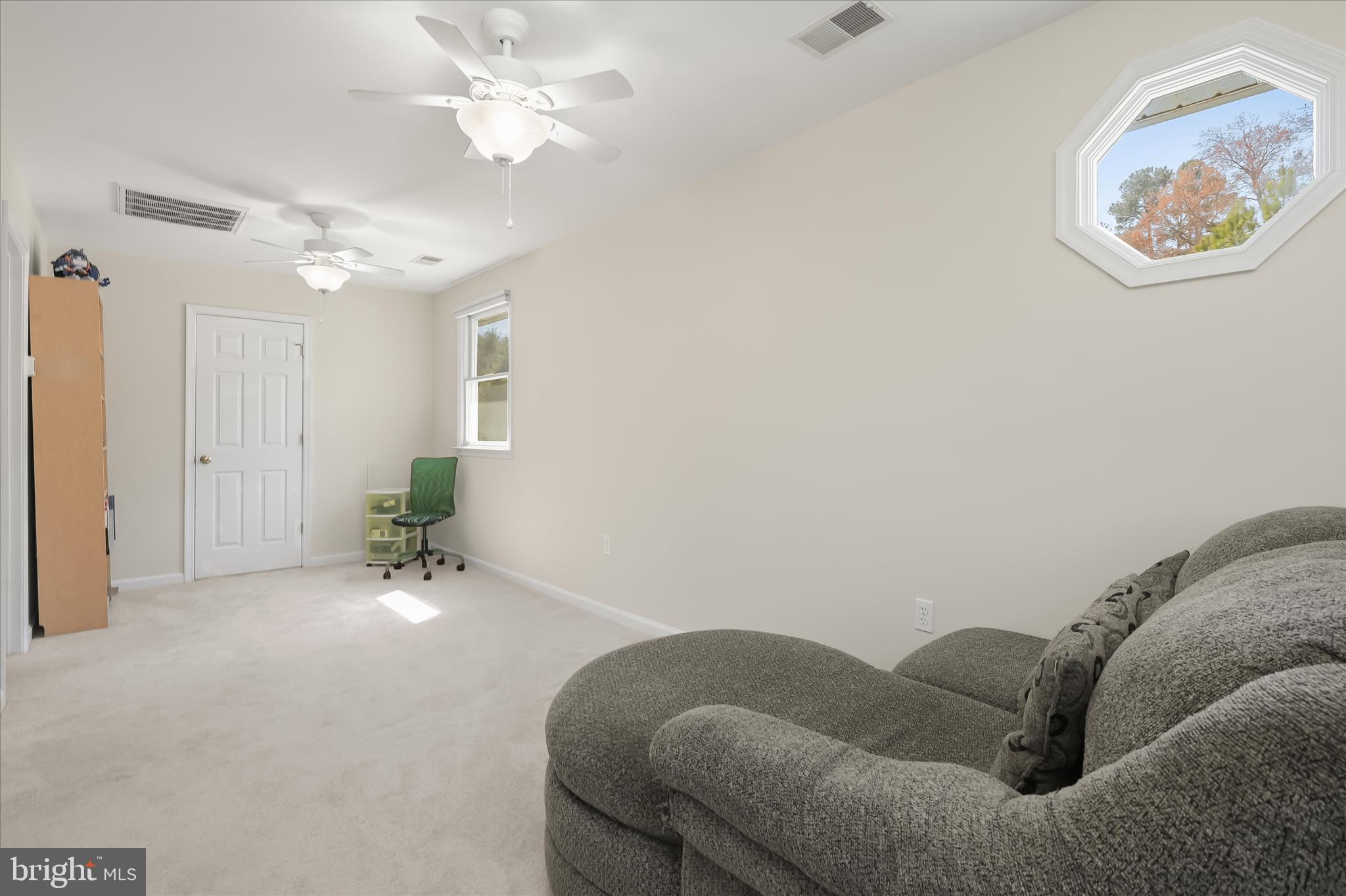 6910 Pindell School Road Clarksville, MD 21029 - Photo 42 of 73 a living room with furniture and a chandelier