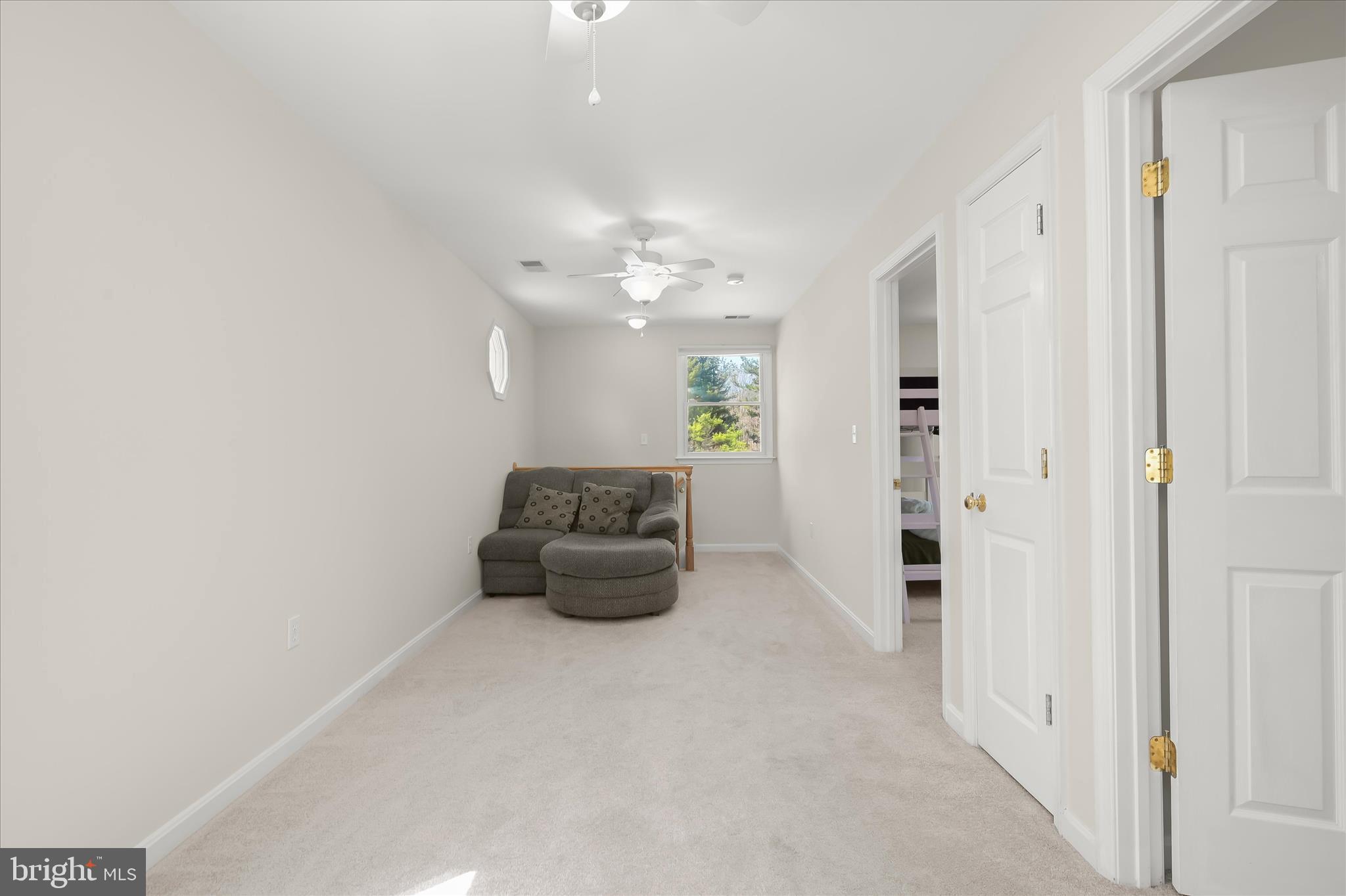 6910 Pindell School Road Clarksville, MD 21029 - Photo 43 of 73 a living room with furniture and a chandelier