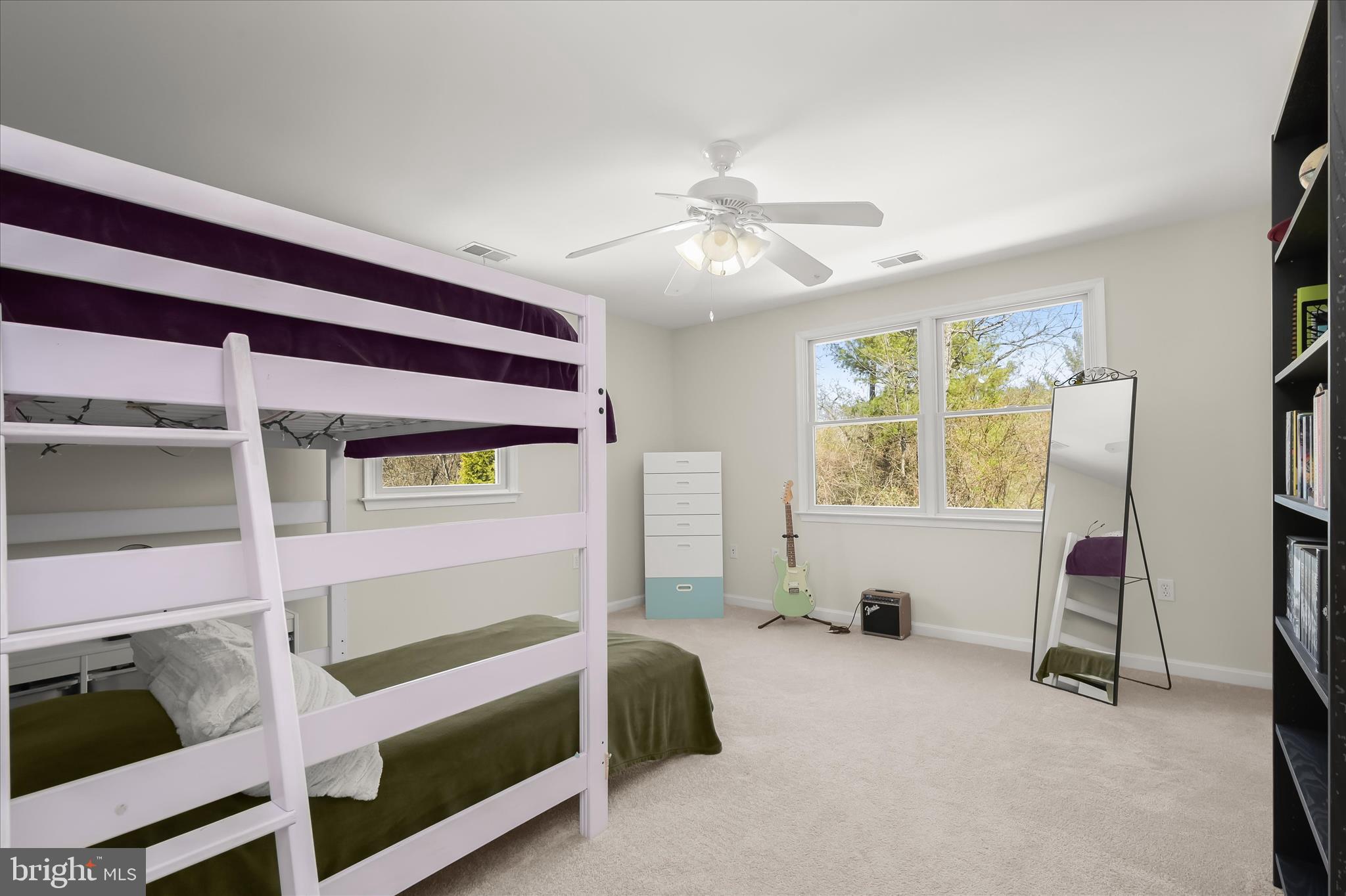 6910 Pindell School Road Clarksville, MD 21029 - Photo 46 of 73 a bedroom with a bed and a chandelier
