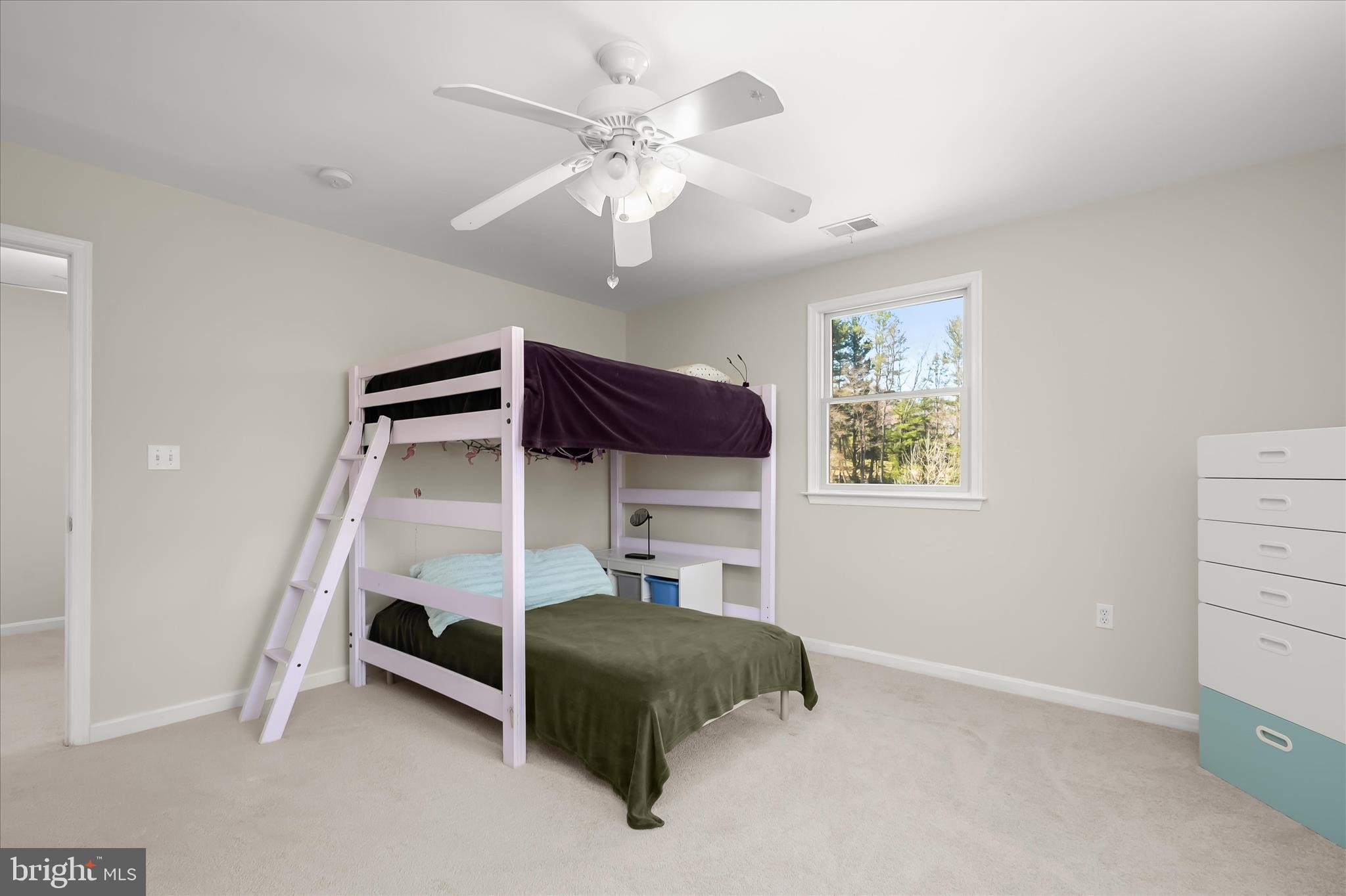 6910 Pindell School Road Clarksville, MD 21029 - Photo 47 of 73 a bedroom with a bed and a ceiling fan