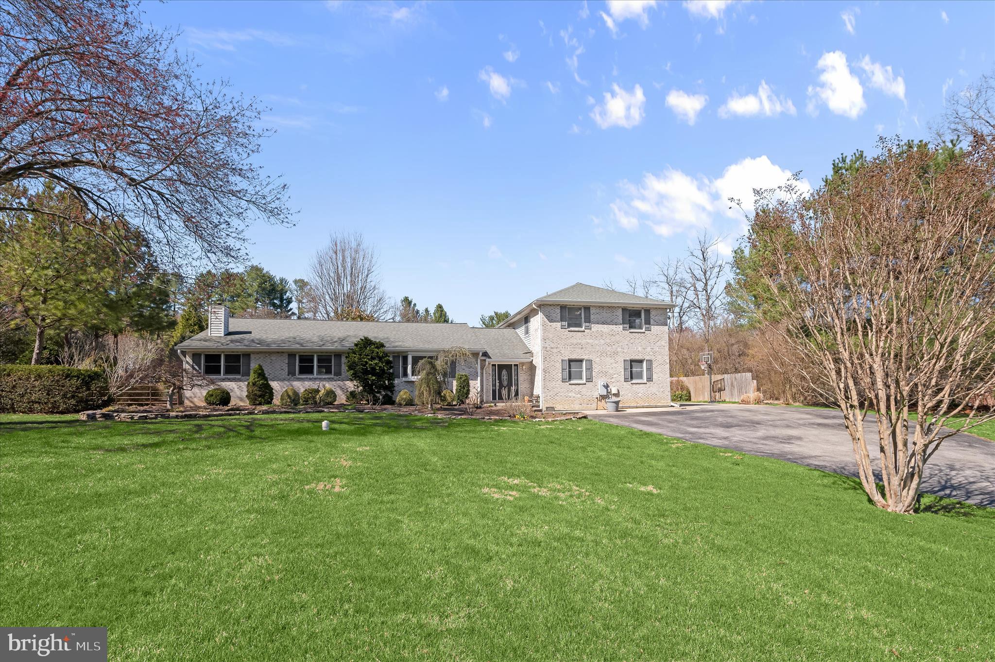 6910 Pindell School Road Clarksville, MD 21029 - Photo 68 of 73 a view of a house with a big yard and large trees