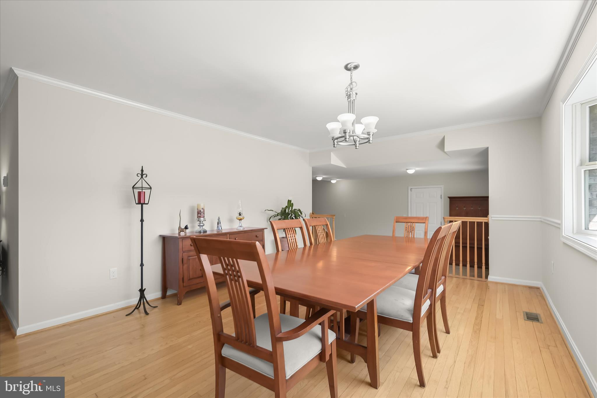6910 Pindell School Road Clarksville, MD 21029 - Photo 10 of 73 a view of a dining room with furniture and chandelier